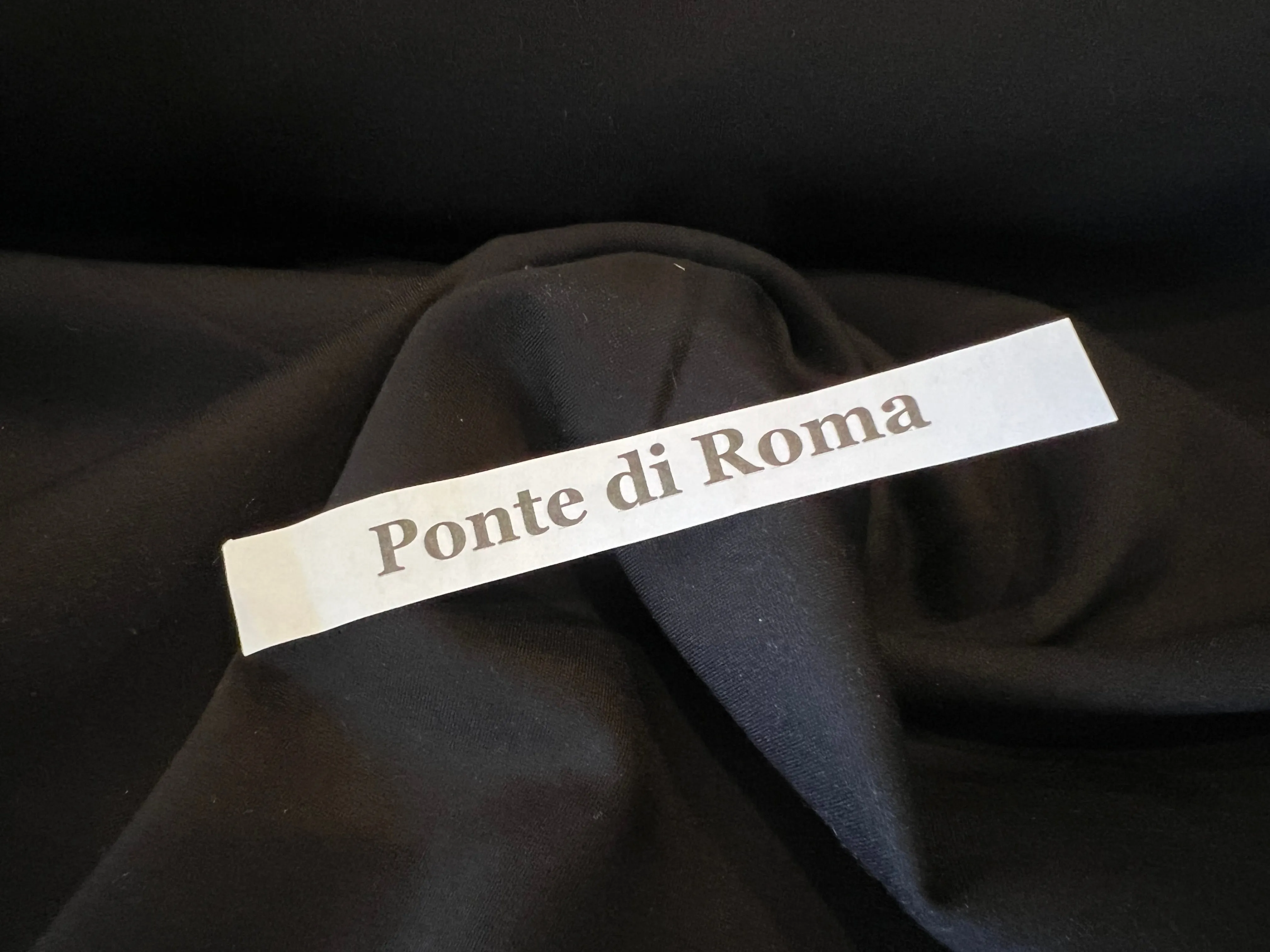 Black Ponte di Roma Knit 68% Viscose 27% Nylon 5% Spandex.  1/4 Meter Price