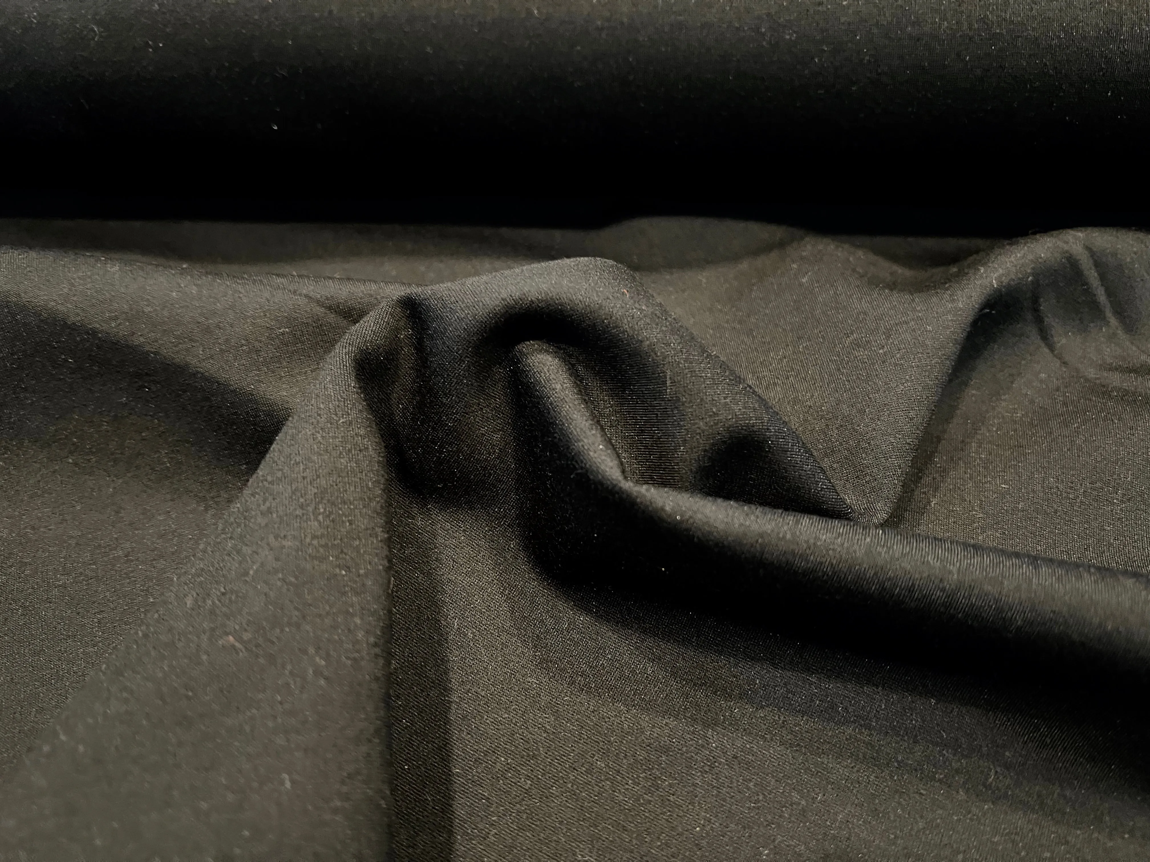 Black Ponte di Roma Knit 68% Viscose 27% Nylon 5% Spandex.  1/4 Meter Price